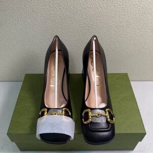 Black Leather Heeled Boots with Gold Horsebit Detail